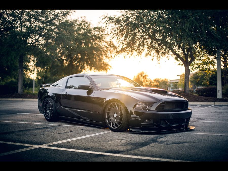 Black coupe with a mirror finish ready for pickup